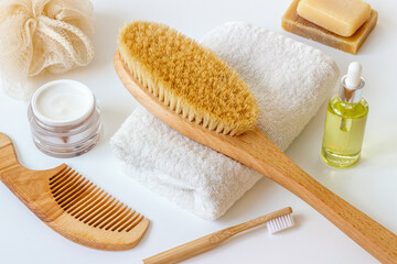 Spa massage body brush with cosmetic products and bath supplies
