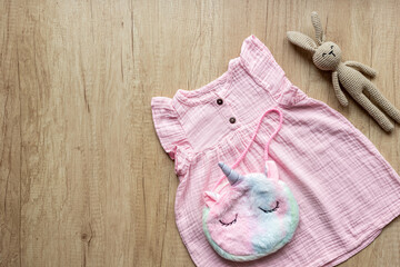 Fashion trendy look of baby girl with pink dress and accessories