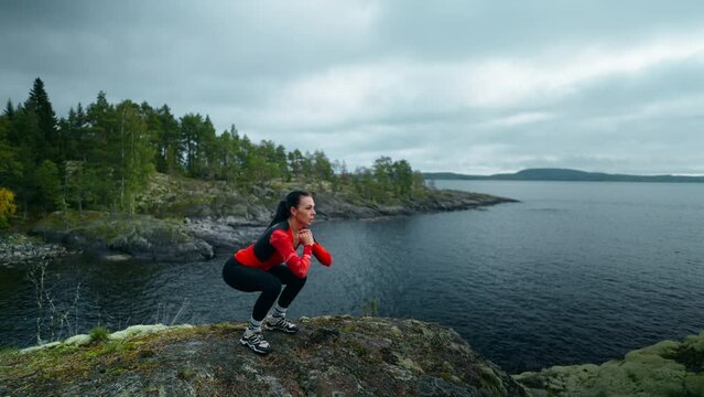 Sportswoman Doing Jumps At Top Of Mount, Training Outdoors In Open Air, Woman Keeping Fit