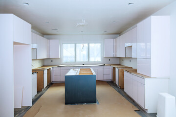 Installation of custom kitchen cabinets a white color in new house