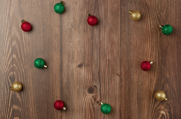Christmas balls on wooden background. Top view. Space for text