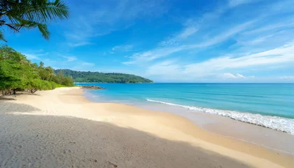 Foto op Plexiglas beautiful sandy beach and sea with clear blue sky background amazing beach blue sky sand sun daylight relaxation landscape view in phuket island thailand for summer and travel background © Mary