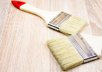 Painting brush, wide, bristles, brush with wooden handle.