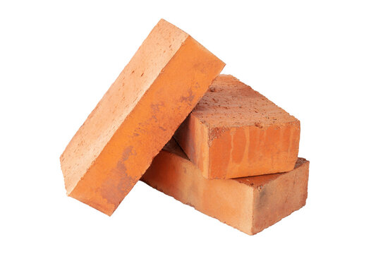 Fototapeta solid fireproof clay brick used for the construction of fireplaces and stoves, on an isolated white background