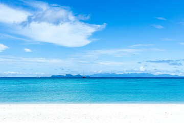Fototapeta na wymiar Beautiful sea, Tropical Turquoise clear blue sea and white sand beach with long tail boats at Lipe Island Satun Thailand 