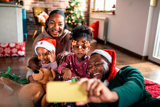 Family taking selfie at home during christmas holidays