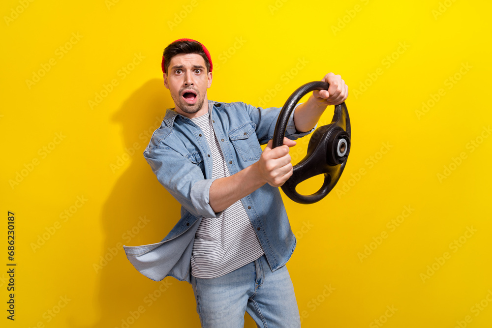 Canvas Prints photo of funky shocked guy wear denim jacket driving car stuck in traffic jam isolated yellow color 