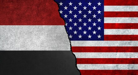 USA and Yemen flag together on a textured wall. Relations between Yemen and United States of America