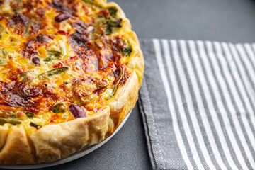 quiche vegetable open pie savory baked goods puff pastry, corn, green peas, beans, green beans, bell pepper healthy eating cooking appetizer meal food snack on the table copy space food background