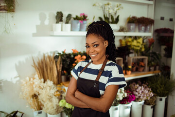 Portrait of a young woman in a flower store