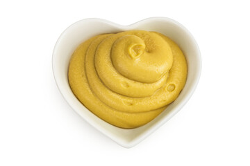 Mustard sauce in ceramic bowl isolated on white background. Top view. Flat lay