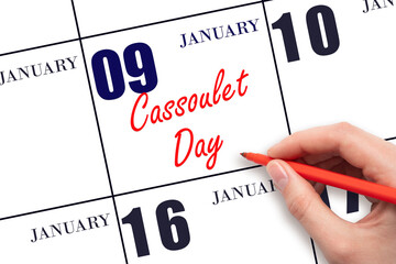 January 9. Hand writing text Cassoulet Day on calendar date. Save the date.