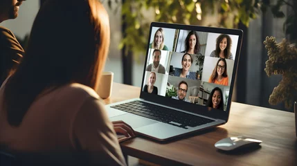 Fotobehang Back view of female employee talk speak on video call on laptop with diverse business people. Online business meeting, video call group of people meeting on virtual workplace or remote office. © petrrgoskov