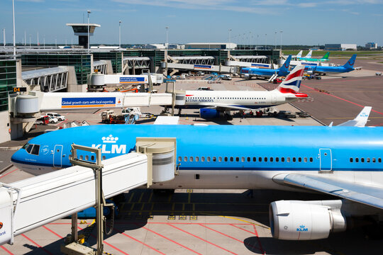 KLM Royal Dutch Airlines passenger plane at the gate of Amsterdam-Schiphol