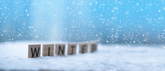 heavy snowfall, panorama of wooden letters on snow, seasonal changes, winter weather conditions and...