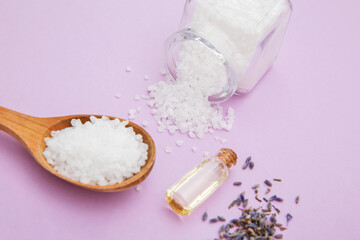 Fototapeta na wymiar Enrichment of sea salt with lavender oil for aromatherapy