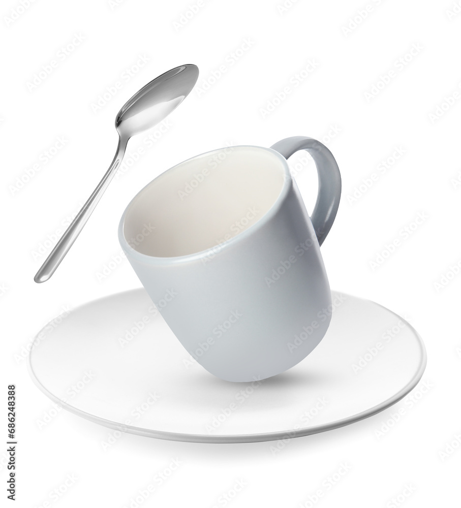 Wall mural Clean plate, cup and spoon falling on white background