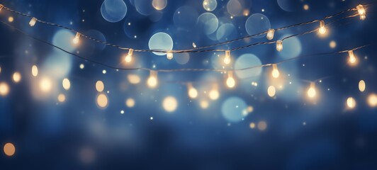 Christmas holiday and Happy New Year decoration and illumination concept. Garland bokeh lights over blue background.