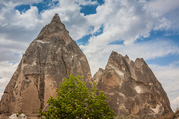 Rocky landscape in Cappadocia, Turkey. Travel in Cappadocia. Unusual semi-desert mountain ranges....