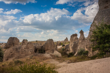 Rocky landscape in Cappadocia, Turkey. Travel in Cappadocia. Unusual semi-desert mountain ranges. Amazing Rocky summer landscape in Cappadocia Goreme