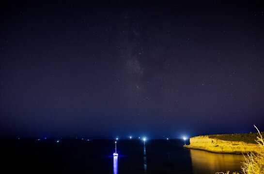 Milky Way over the sea at night in the Algarve, Portugal.