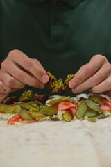 Man cooking homemade falafel meal.