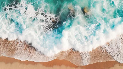 Tuinposter ฺBlue ocean waves crashing on rocks and beach Aerial top view of blue seascape white air foam. The beauty of the sea with free space ,background surface , Texture © Suphachai