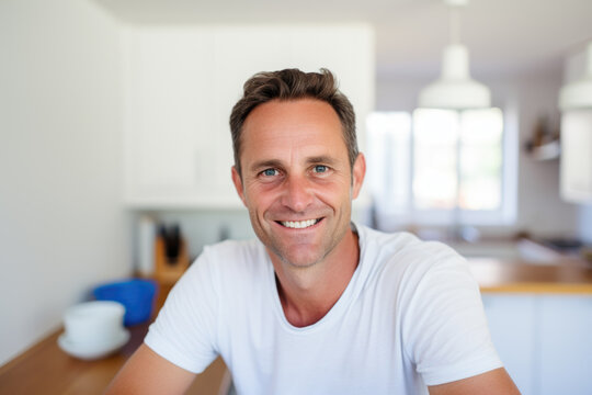 Portrait of a smiling man 41 years old in the kitchen