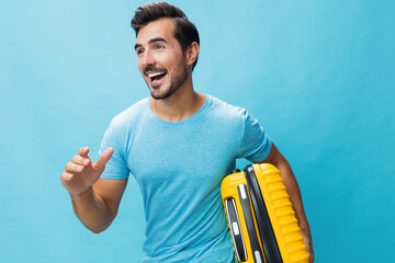 Baggage man background travel weekend yellow guy studio journey flight traveler suitcase vacation...