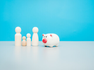 Wooden figures. Financial wealth and family well-being. Saving concept.
