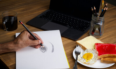 Office table desk. Workspace with blank, office supplies, laptop, eyes glasses, hot black coffee cup and butter bread sunny side up omlet on wood background. - obrazy, fototapety, plakaty