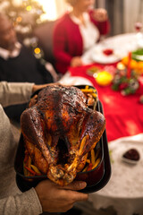 Turkey is being served on the dining table on Christmas Eve.