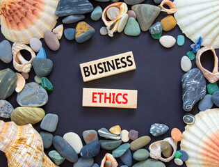 Business ethics symbol. Concept words Business ethics on beautiful wooden blocks. Beautiful black...