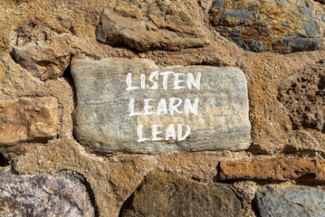 Listen learn lead symbol. Concept word Listen Learn Lead on beautiful big stone. Stone wall. Beautiful stone wall background. Business education listen learn lead concept. Copy space