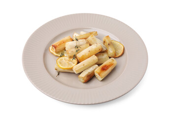 Plate with baked salsify roots, lemon and thyme isolated on white