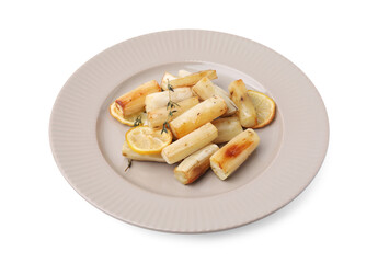 Plate with baked salsify roots, lemon and thyme isolated on white