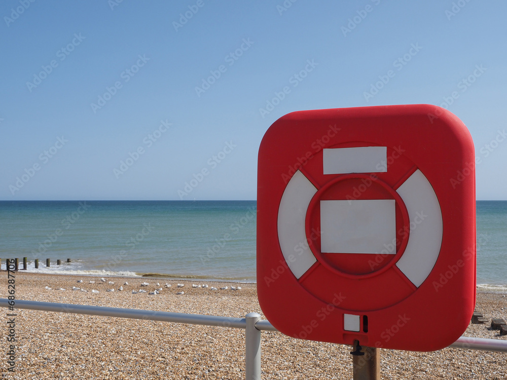 Poster lifebuoy by the sea