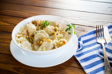 Ukrainian dumplings stuffed with potatoes and mushrooms, served with fried onions.