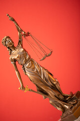 Bronze statue of the Goddess of Justice Themis, holding the Law Scales in her hands,