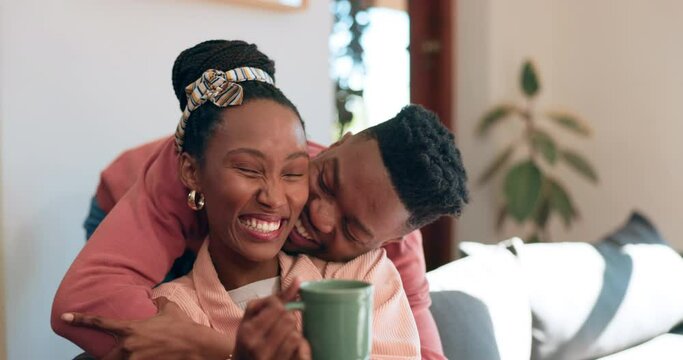 Sofa, love and couple hug a living room together in the morning as care, happiness and calm in a home. Happy, African and man bonding with woman in an apartment as support and surprise visit