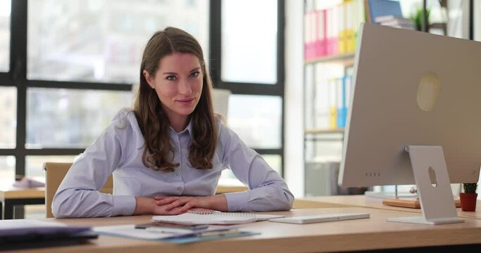 Portrait of beautiful female boss shaking head in agreement and approval