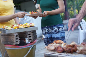 Asian, American and African family parties with grilled seafood and beer drinks, BBQ