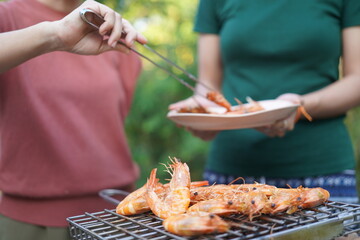 Asian, American and African family parties with grilled seafood and beer drinks, BBQ