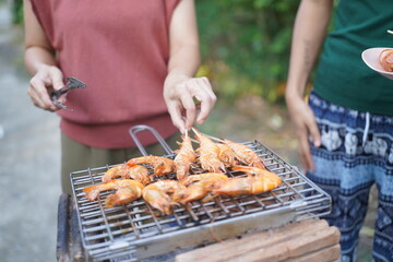 Asian, American and African family parties with grilled seafood and beer drinks, BBQ