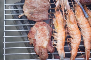 Asian, American and African family parties with grilled seafood and beer drinks, BBQ