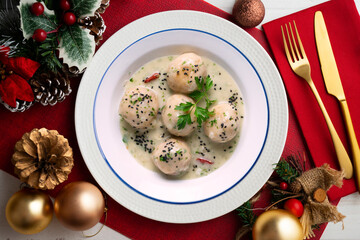 Fish meatballs with white wine sauce. Traditional tapas from Barcelona, ​​Spain. Christmas food...