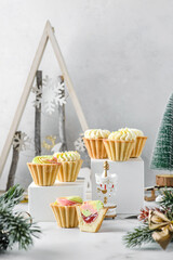 Obraz na płótnie Canvas christmas mini cream cakes in in shortbread tartlets