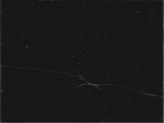 Texture of broken glass with scratches on black background for Y2K style work and creating crack...