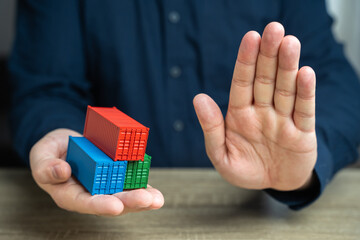 Shipping containers and a stop gesture. Refusal and blocking. Break a trade deal. Economic embargo....