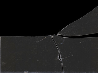 Texture of broken glass fragments with scratches and black background space for mockups for Y2K...